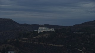 AX0158_009 - 7.6K aerial stock footage orbiting the front of the Griffith Observatory, twilight, Los Angeles, California