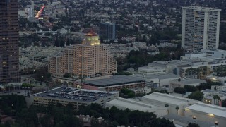 AX0158_026 - 7.6K aerial stock footage orbiting the Intercontinental Hotel at twilight, Century City, California