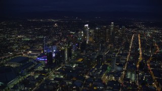 AX0158_082 - 7.6K stock footage aerial video of a wide view of skyscrapers at night in Downtown Los Angeles, California