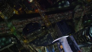 AX0158_123 - 7.6K aerial stock footage of a bird's eye orbit of Wilshire Grand Center and nighttime traffic on the 110 Freeway in Downtown Los Angeles, California