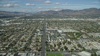 AX0159_001 - 7.6K stock footage aerial video flying over suburban neighborhoods, Pacoima, San Fernando Valley, California