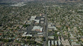 AX0159_004 - 7.6K aerial stock footage flying over Glenoaks Blvd and shopping centers, Sylmar, California