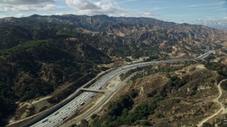 AX0159_011 - 7.6K stock footage aerial video flying over I-5 with light traffic, Santa Clarita, California