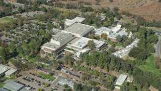 AX0159_014 - 7.6K aerial stock footage tilting down on California Institute of the Arts, Santa Clarita, California