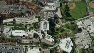 AX0159_015E - 7.6K aerial stock footage orbiting away from College of the Canyons campus, Santa Clarita, California