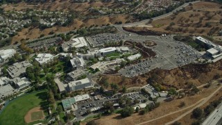 AX0159_016 - 7.6K stock footage aerial video orbiting away from College of the Canyons campus, Santa Clarita, California