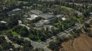 AX0159_018 - 7.6K stock footage aerial video orbiting the campus of California Institute of the Arts, Santa Clarita, California