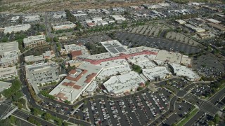 AX0159_025 - 7.6K stock footage aerial video orbiting a shopping mall, Santa Clarita, California