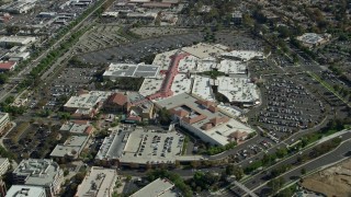 AX0159_026E - 7.6K aerial stock footage of a high orbit of a shopping mall, Santa Clarita, California