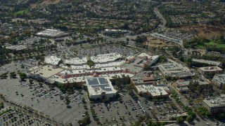 AX0159_027 - 7.6K stock footage aerial video of a high orbit of a shopping mall, Santa Clarita, California