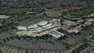 AX0159_028E - 7.6K aerial stock footage of a reverse orbit of a shopping mall and parking lot, Santa Clarita, California