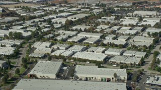 AX0159_034 - 7.6K stock footage aerial video of office buildings and warehouses, Valencia, California