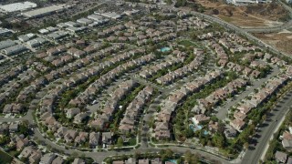 AX0159_036 - 7.6K stock footage aerial video flying over tract homes, Valencia, California