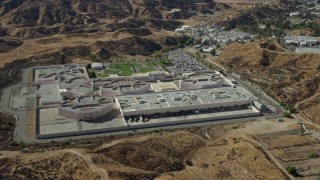 AX0159_043E - 7.6K aerial stock footage of a detention facility, Valencia, California