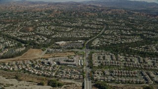 AX0159_046 - 7.6K stock footage aerial video flying over tract homes, Valencia, California