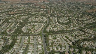 AX0159_047 - 7.6K stock footage aerial video of tract homes, Valencia, California