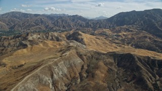 AX0159_052E - 7.6K aerial stock footage flying over Canyon Country and houses, California