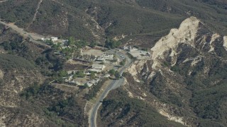 AX0159_057 - 7.6K aerial stock footage of a religious retreat center nestled in the canyons, Sylmar, California