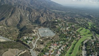 AX0159_065 - 7.6K aerial stock footage of a power station near a country club, La Cañada Flintridge, California