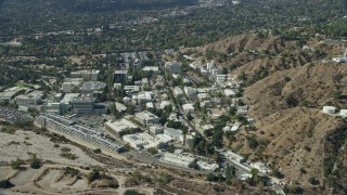 AX0159_083E - 7.6K aerial stock footage flying over JPL facility toward neighboring suburban houses; Pasadena, California