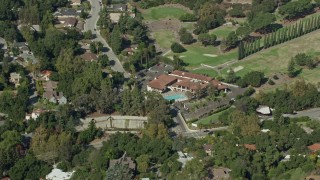 AX0159_090 - 7.6K aerial stock footage orbiting Chevy Chase Country Club, Glendale CA
