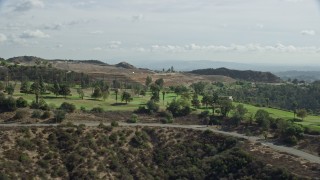 AX0159_091 - 7.6K aerial stock footage of a hilltop golf course, Glendale, California