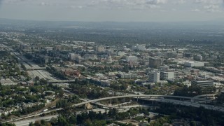 AX0159_103 - 7.6K aerial stock footage of Pasadena City Hall and office buildings across the 134 freeway, Pasadena, California