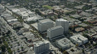 AX0159_108E - 7.6K aerial stock footage orbiting office buildings in Pasadena, California