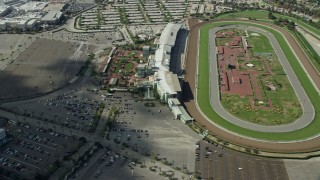 AX0159_115E - 7.6K aerial stock footage orbiting the Santa Anita Park horse racing track in Arcadia, California