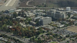 AX0159_123 - 7.6K aerial stock footage approaching the City of Hope Medical Center in Duarte, California