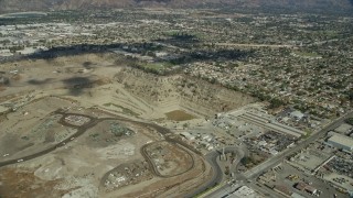 AX0159_127 - 7.6K aerial stock footage flying by a large gravel quarry in Irwindale, California