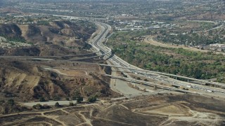 AX0159_157 - 7.6K aerial stock footage of Highway 91 at Highway 241, Anaheim, California