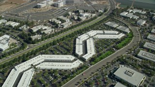 AX0159_174 - 7.6K aerial stock footage orbiting a business park, Irvine, California