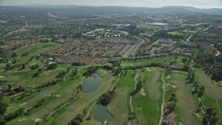 AX0159_177E - 7.6K aerial stock footage flying over golf course and tract homes, Aliso Viejo, California