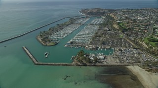 AX0159_188E - 7.6K aerial stock footage of Dana Point Harbor and seaside neighborhoods in Dana Point, California