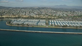 AX0159_190 - 7.6K aerial stock footage of Dana Point Harbor and oceanfront neighborhoods in Dana Point, California
