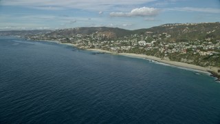 AX0159_204E - 7.6K aerial stock footage of oceanfront homes beside Table Rock Beach, West Street Beach in Laguna Beach, California