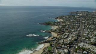 AX0159_211 - 7.6K aerial stock footage flying over coves and bay near coastal highway, Laguna Beach, California