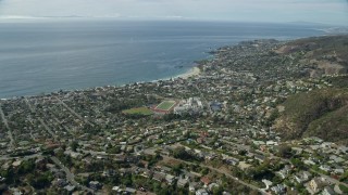 AX0159_217E - 7.6K aerial stock footage flying over homes and Main Beach Park, Laguna Beach, California