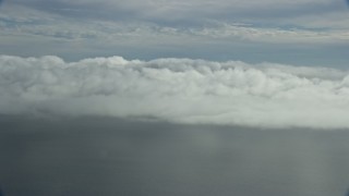 AX0159_243 - 7.6K stock footage aerial video of clouds over the Pacific Ocean in Southern California