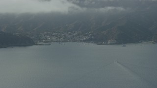 AX0159_245 - 7.6K aerial stock footage approaching the harbor and the island town of Avalon, Catalina Island, California
