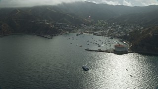 AX0159_255E - 7.6K aerial stock footage of the bay and the town of Avalon, Catalina Island, California
