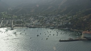 AX0159_264E - 7.6K aerial stock footage flying away from the small island town of Avalon, Santa Catalina Island, California