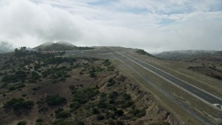 AX0159_272 - 7.6K stock footage aerial video approaching the Catalina Airport runway on Santa Catalina Island, California