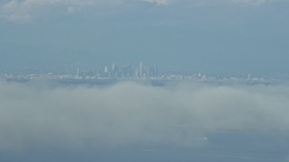 AX0160_024 - 7.6K aerial stock footage of Downtown Los Angeles skyline seen from Catalina Island, California