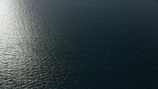 AX0160_035 - 7.6K aerial stock footage of a reverse view of the Pacific Ocean off the coast of Southern California