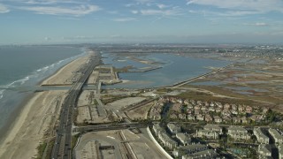 AX0160_046 - 7.6K aerial stock footage flying over Hwy 1 and beach to Bolsa Chica Basin State Marine Conservation Area, Huntington Beach, California