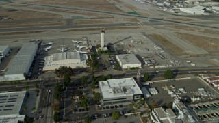 AX0160_066 - 7.6K aerial stock footage approaching the control tower and runways at Long Beach Airport, California
