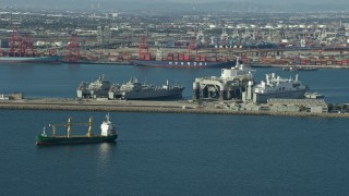 AX0161_010E - 7.6K aerial stock footage of Sea Launch ship docked near vessels at the Port of Long Beach, California