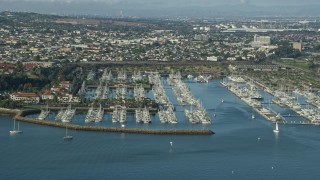 AX0161_015 - 7.6K aerial stock footage of boats docked at a marina in San Pedro, California